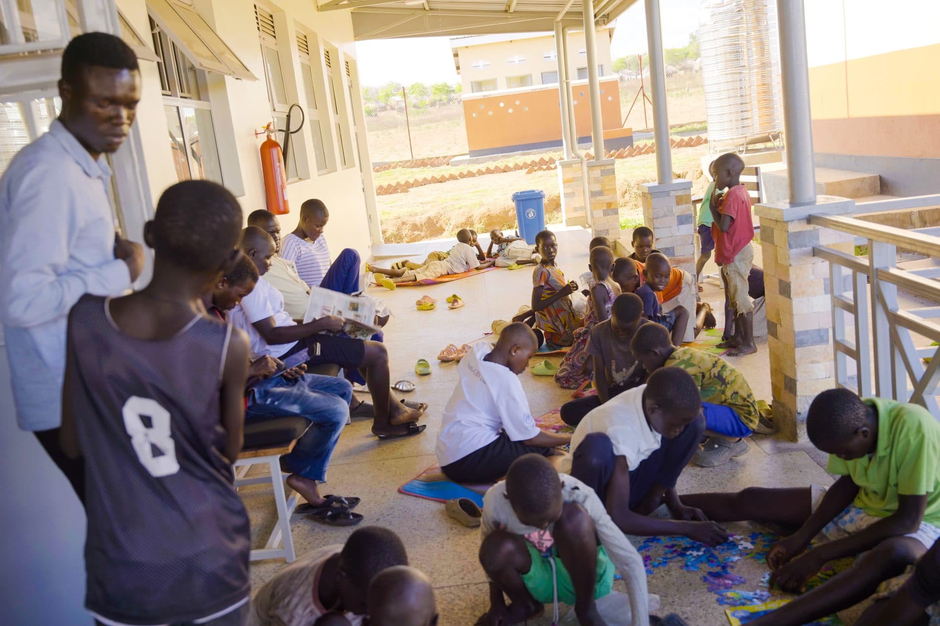 Children gathering for community learning activities
