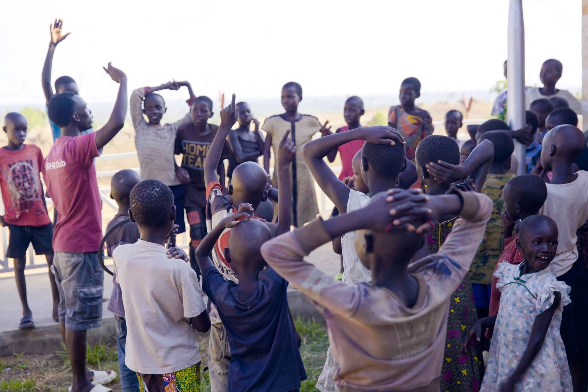 Children and youth gathered during a community peacebuilding activity